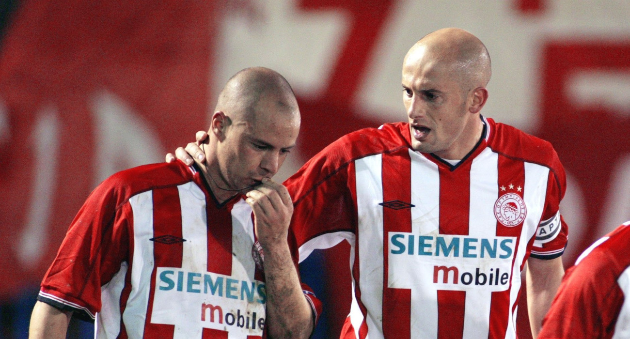 Στέλιος Γιαννακόπουλος και Πρέντραγκ Τζόρτζεβιτς σε αγώνα του Ολυμπιακού / Πηγή: Intime